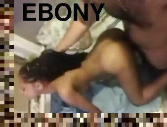 Pulling ebony dreadlocks