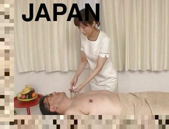 Female masseur from Japan treats the erection of her new customer