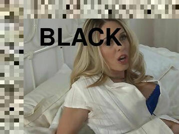 Blonde porn star with big fake tits sucking a huge black cock