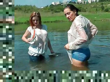 Lesbo hotties making out in a lake get real wet
