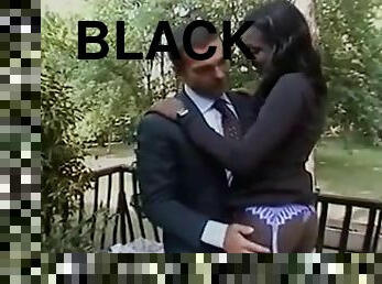 Black bitch wearing a bra gets fucked doggy style outdoors