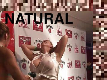 Some nasty girls show their natural tits at a show