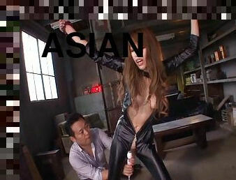 Kinky Asian in a leather catsuit sucks dick erotically