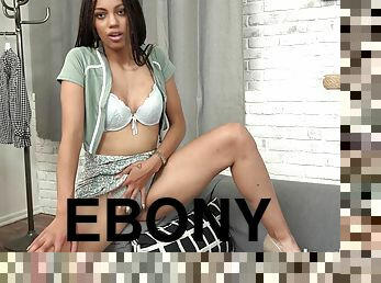 Solo ebony Dhalia Janeiro removes her panties to masturbate