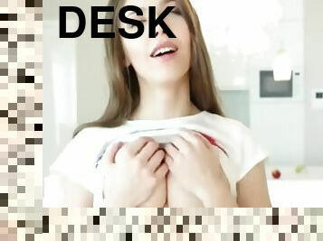 Slutty brunette teen fingering her wet pussy on white desk