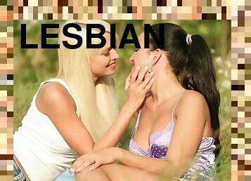 Lesbians Jessie Hazz and Nicole Vice go wild on the grass