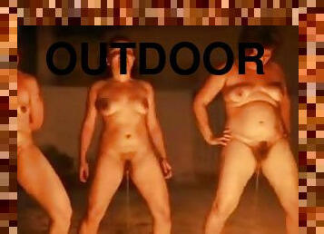A few chubby women have fun outdoors in night piss fetish scene