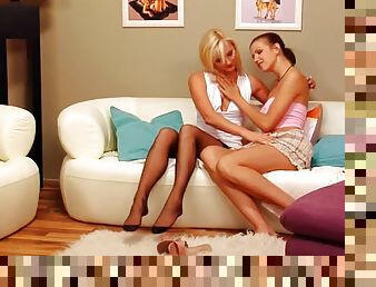 Sexy blonde puts her stockings on and plays lesbian games with her friend