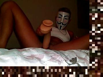 Masked transman rides large dildo