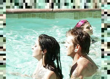 Two girls and a guy have some hardcore fun in the pool