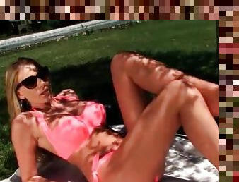 Busty Danielle Maye models pink bikini outdoors