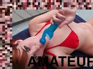 Teen redhead masturbating pussy by the pool