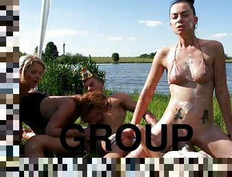 Luscious babes being bonked hardcore in a wild groupsex shoot by the lake