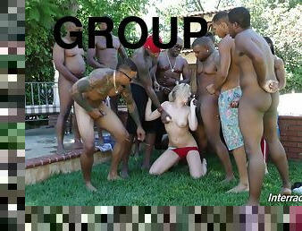 Swimsuit slut strips for a group of black guys and sucks them off