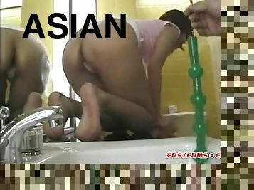 Asian slut at home in bathroom dildo fucking her both holes