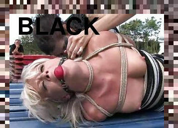 Hungry blondie is circling around that fat black cock in the park!