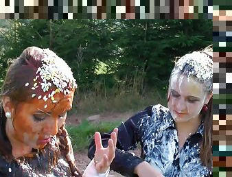 Stunning vixens have an arousing food fight on the farm in a close up shoot