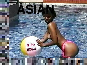 Beautiful Asian girl goes totally naked by the pool and reveals tits