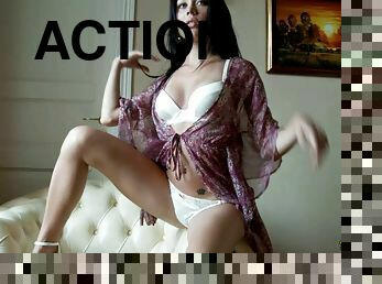 Dark-haired bimbo gets on the armchair and enjoys the solo action