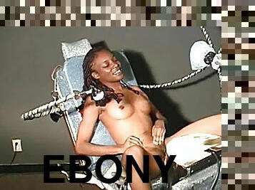 Slim ebony chick gets her hairy pussy toyed by a machine
