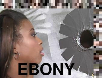 A very perverted ebony chick is enjoying a huge gloryhole cock