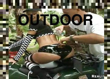 OIled up outdoor with a booty biker girl