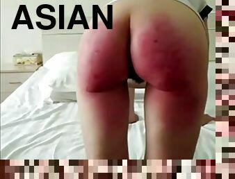 Asian babe with a bubble butt gets a hard otk spanking