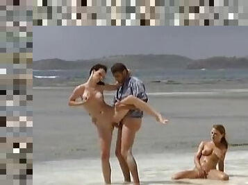 Elena and Rita Neri get fucked on a beach in FFM video