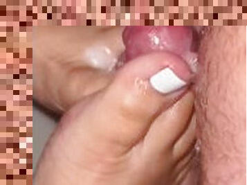 Got my freshly pedicured white toes covered in warm cum