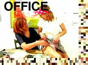 Two girls enjoy licking and toying each other's vags in an office