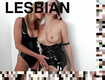 Two lesbians in leather bodysuits lick and toy their pussies