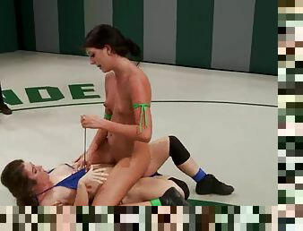 Two slim brunette chicks fight and fuck in a ring