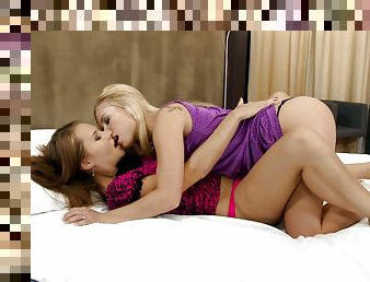 Charming lesbians make some lesbian love in a bedroom