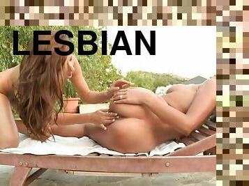 Two hot brown-haired girls have lesbian sex on a lounge