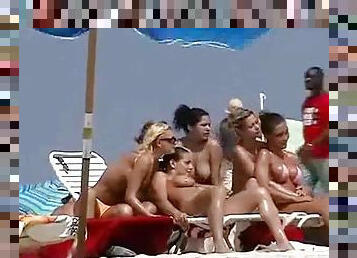 Nude beach hotties get filmed with a hidden cam while having rest