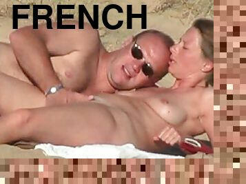 Horny French dude drills his wife's pussy on a beach