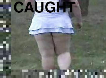 Chubby girl in extremely short skirt gets caught on a spy cam