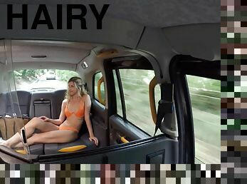 A taxi driver fucks some hot naked babe with a hairy pussy.