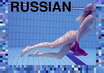 Gorgeous Russian blonde Elena Proklova shows her body in the pool