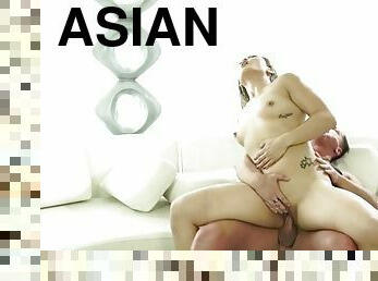 Tattooed Asian takes a hot ride on a hard cock