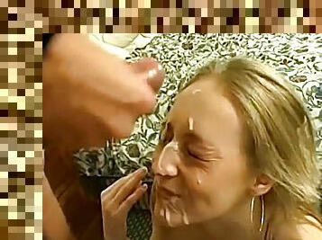 Foxy blonde uses her hands to make a dick cum on her face
