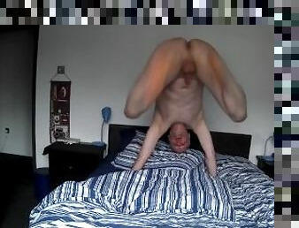 Naked man bouncing on the bed