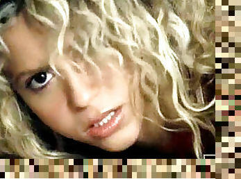 Blonde Shakira practices before performing live on the stage