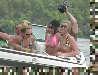 Nasty amateur girls sitting in a boat flash their boobs