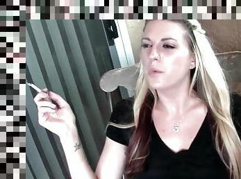 Blonde hangs out on the deck and smokes