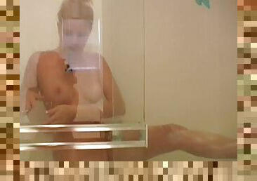 Leg shaving naked blonde in the shower