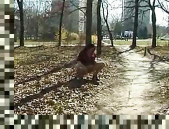 Hot slut with big tits pissing in a public park