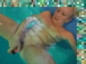 Grandma solo dildo sex in the pool