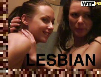 Two beautiful girls play lesbian games in the bathroom