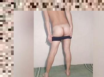 A young hot guy poses in underwear and takes off his blue panties - boxers showing his dick and ass